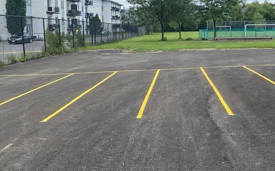 Yellow lines on pavement in schoolyard